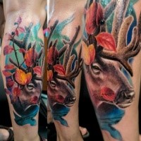 Beautiful colored leg tattoo of deer head with leaves
