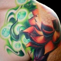 Beautiful colored shoulder tattoo of glowing lotus flower