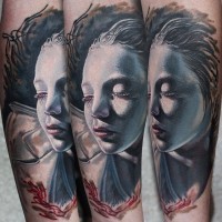 Beautiful colored very realistic sleeping girl tattoo on arm