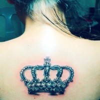 Beautiful crown tattoo on upper back