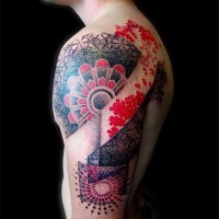 Beautiful designed and colored massive floral like tattoo on shoulder
