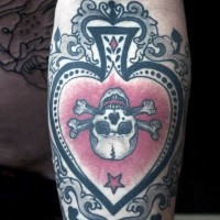 Beautiful designed big colored spades with skull tattoo on arm