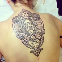 Beautiful designed black and white Hinduism pattern tattoo on upper back