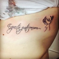 Beautiful designed black ink famous spell lettering tattoo with deer pattern