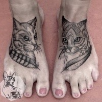 Beautiful dot style black ink feet tattoo of nice cats with feather