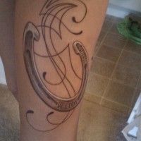 Beautiful elegant horseshoe tattoo on thigh