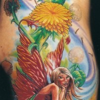Beautiful fantasy world Tinkerbell tattoo on shoulder with flowers and dragonfly