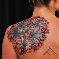 Beautiful illustrative style scapular tattoo of big flowers with ornaments