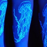 Beautiful jellyfish black light tattoo