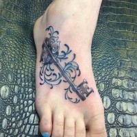 Beautiful key foot tattoo for women