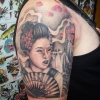 Beautiful looking black ink shoulder tattoo of geisha with flowers and mountain river