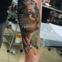Beautiful looking colored forearm tattoo of woman stylized with wings