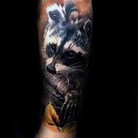 Beautiful looking colored leg tattoo of cute raccoon with leaves