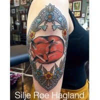 Beautiful looking colored shoulder tattoo of sleeping fox with flowers
