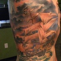 Beautiful looking colored side tattoo of big pirate sailing ship