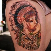Beautiful looking colored thigh tattoo of Indian woman with owl