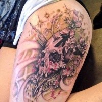 Beautiful looking colored thigh tattoo of human skull with butterflies