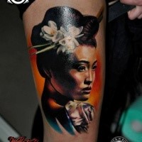 Beautiful looking colored thigh tattoo of detailed Asian geisha