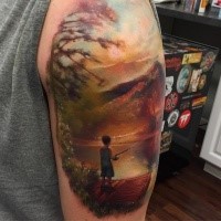 Beautiful looking shoulder tattoo of little boy fisherman