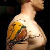Beautiful multicolored shoulder tattoo of nice bird with blooming tree