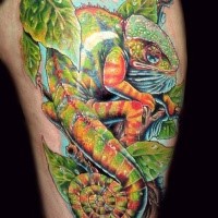 Beautiful natural looking thigh tattoo of big chameleon