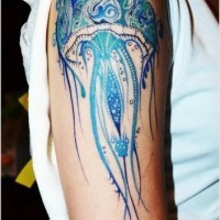 Beautiful painted and styled multicolored jelly-fish tattoo on shoulder