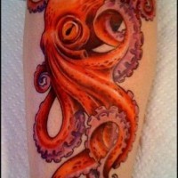 Beautiful realistic red octopus tattoo on leg