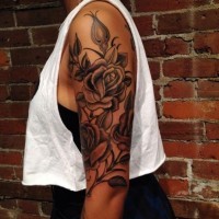 Beautiful roses tattoo on half sleeve by Billy DeCola