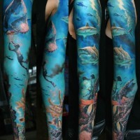 Beautiful shark and diver in ocean tattoo on full sleeve
