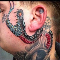 Snake tattoo on neck and face