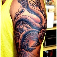 Beautiful snake with roses tattoo on half sleeve