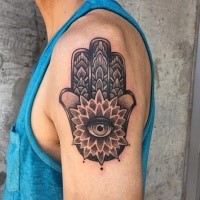 Beautiful stippling style shoulder tattoo of Hamsa symbol