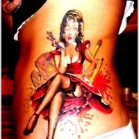 Beautiful vintage style seductive woman painter tattoo on waist