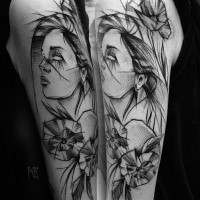 Beautiful woman portrait sketch tattoo painted by Inez Janiak on upper arm with flowers