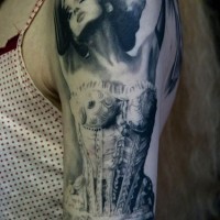 Beautiful women in a corset tattoo on arm