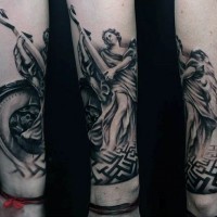 Big 3D like black and white angel statue tattoo on forearm with cross