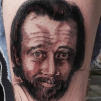Big 3D like colored famous star portrait tattoo on thigh