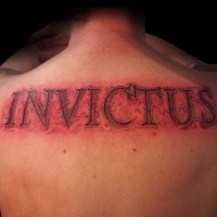 Big 3D like very detailed antic lettering tattoo on upper back