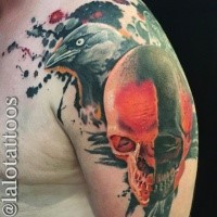 Big accurate looking colored shoulder tattoo of crow with human skull