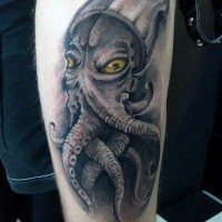 Big alien like colored squid tattoo on leg