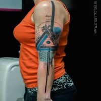 Big amazing looking arm tattoo of mystical symbol with lettering