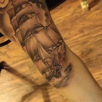 Big beautiful looking arm tattoo of sailing ship