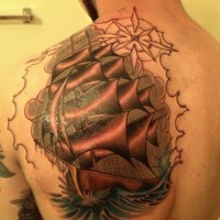 Big beautiful ship tattoo on shoulder blade