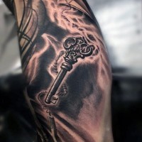 Big black and white 3D antic key tattoo on arm