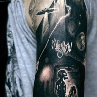 Big black and white alien ships with human skeleton half sleeve tattoo