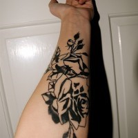 Big black and white flowers on inner side of hand