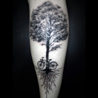 Big black and white lonely tree big bicycle tattoo on leg