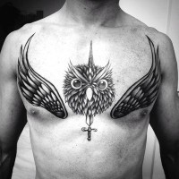 Big black and white owl head with sword and wings tattoo on chest