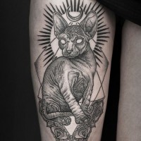 Big black and white Sphinx cat cult tattoo on thigh
