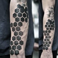 Big black ink dotwork style arm tattoo of geometrical ornament